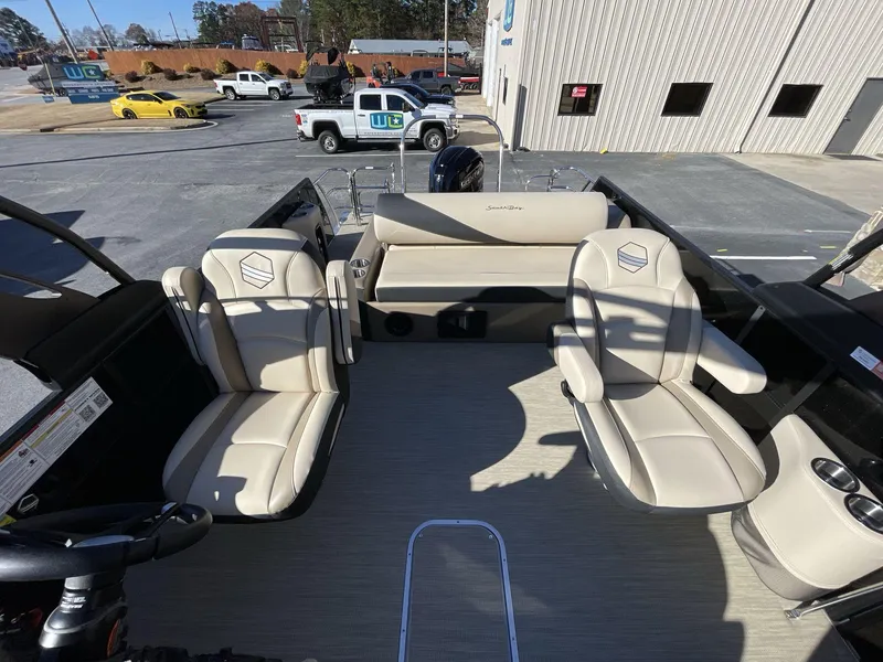 Slide: The Image of 2025 South Bay S224RS boat interior with beige seating and modern design. - 14