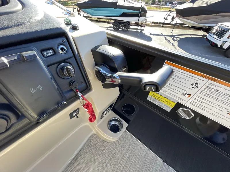 Slide: The Image of 2025 South Bay S224RS boat control panel with throttle and warning labels. - 19