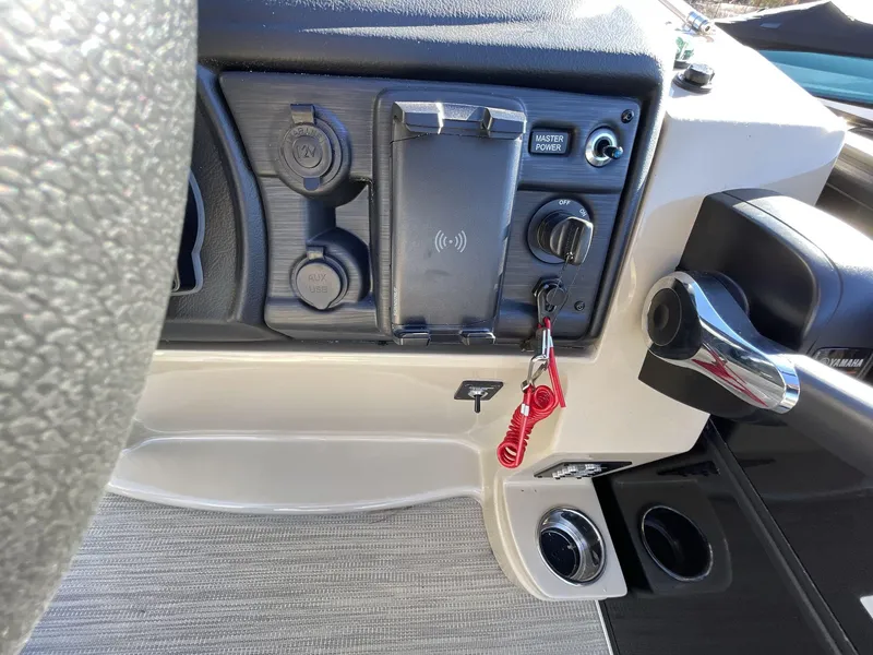 Slide: The Image of Dashboard of 2025 South Bay S224RS boat with controls and key. - 22