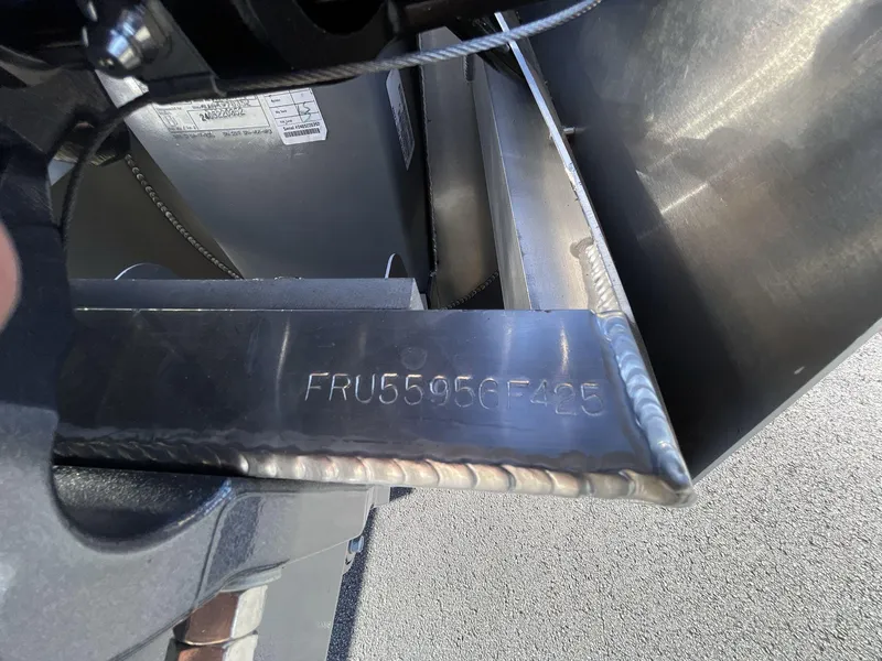 Slide: The Image of Close-up of a 2025 South Bay S224RS boat's metal component with serial number FRU55956F425. - 23