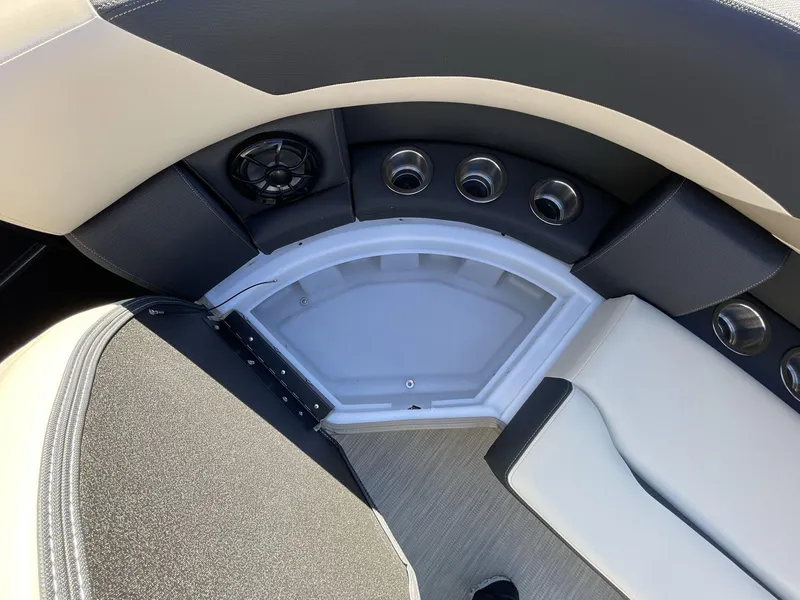 Slide: The Image of Interior seating of 2025 South Bay S224RS boat with speaker and cup holders. - 25