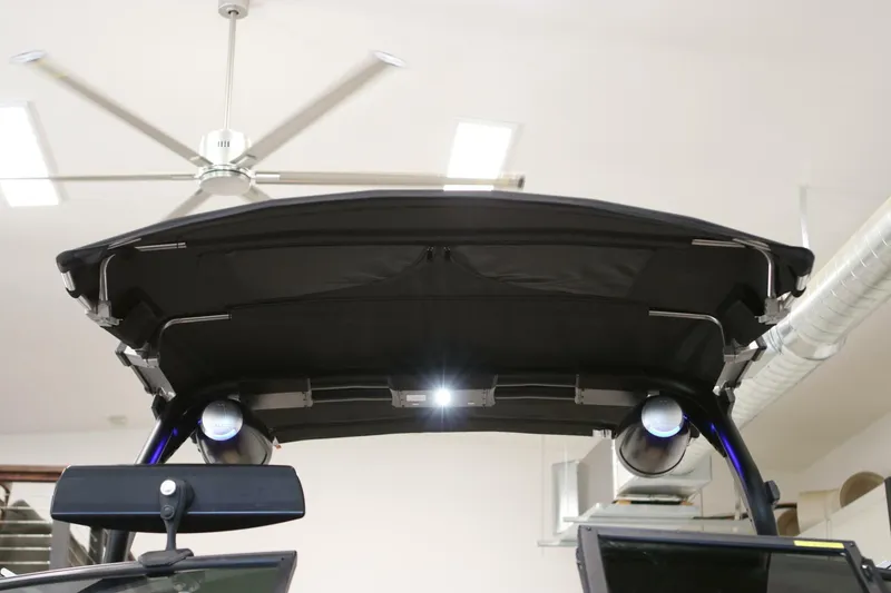 Slide: The Image of 2018 Supra SR400 boat canopy with speakers and lighting in a garage setting. - 108