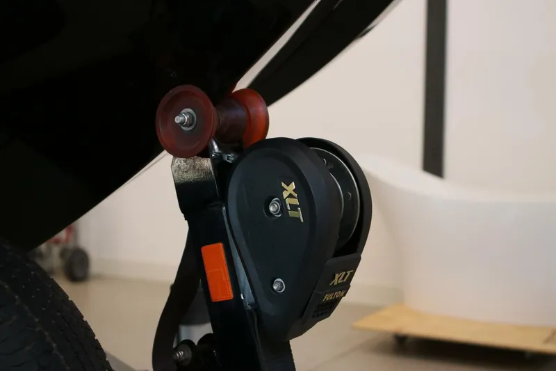 Slide: The Image of Close-up of a 2018 Supra SR400 trailer winch and roller system. - 113