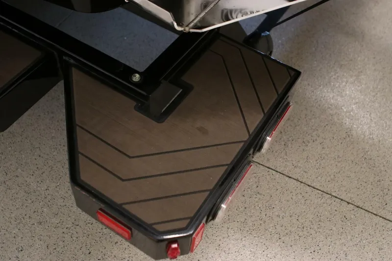 Slide: The Image of 2018 Supra SR400 boat trailer step with non-slip surface and red reflectors. - 119