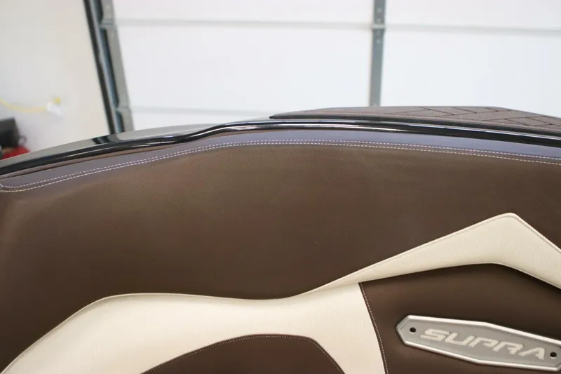 Slide: The Image of 2018 Supra SR400 interior detail with brown and cream upholstery design. - 14