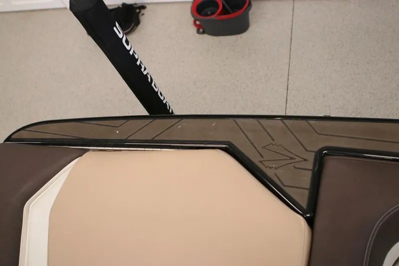 Slide: The Image of 2018 Supra SR400 boat interior with beige and brown seating, and branded pole. - 25