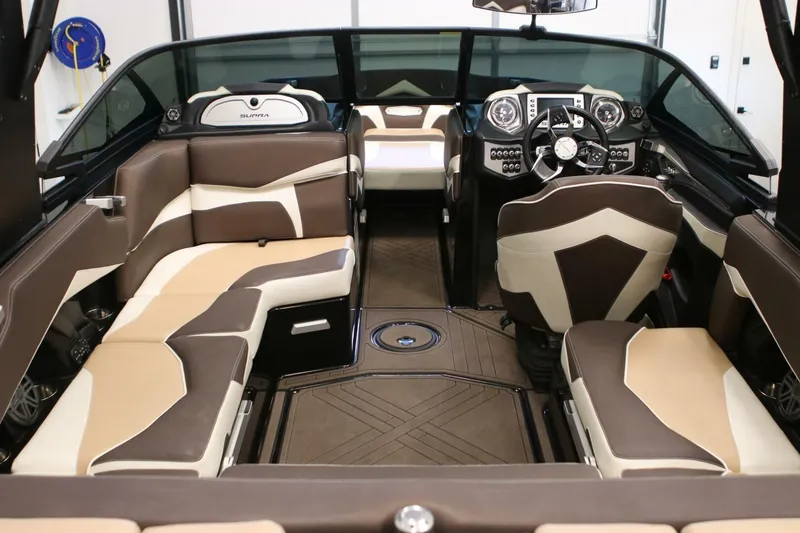 Slide: The Image of Interior of a 2018 Supra SR400 boat with luxurious seating and modern dashboard. - 31