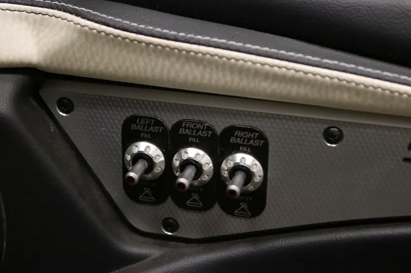 Slide: The Image of 2018 Supra SR400 ballast control panel with switches for left, front, and right ballast. - 38