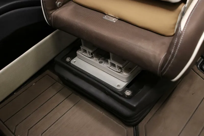 Slide: The Image of 2018 Supra SR400 seat base detail with brown upholstery and metal mounting. - 47