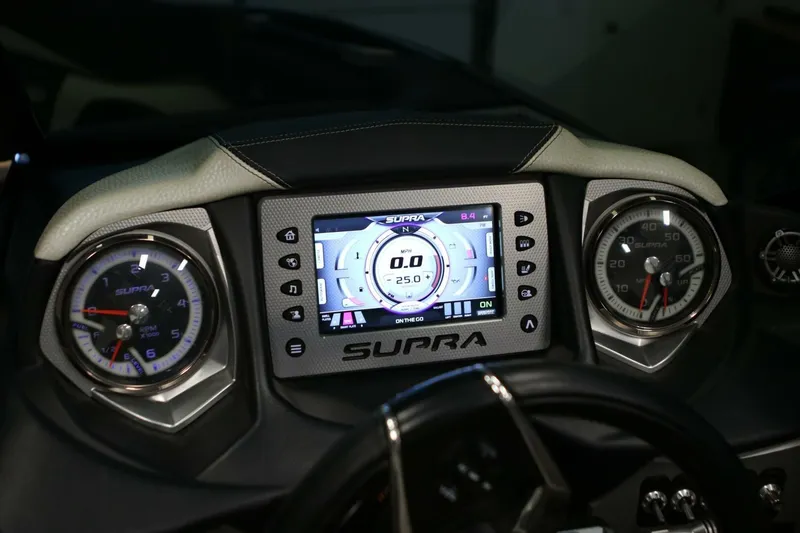Slide: The Image of 2018 Supra SR400 dashboard with digital display and analog gauges. - 49