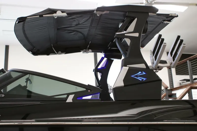 Slide: The Image of 2018 Supra SR400 boat with sleek design and advanced wakeboard tower. - 6