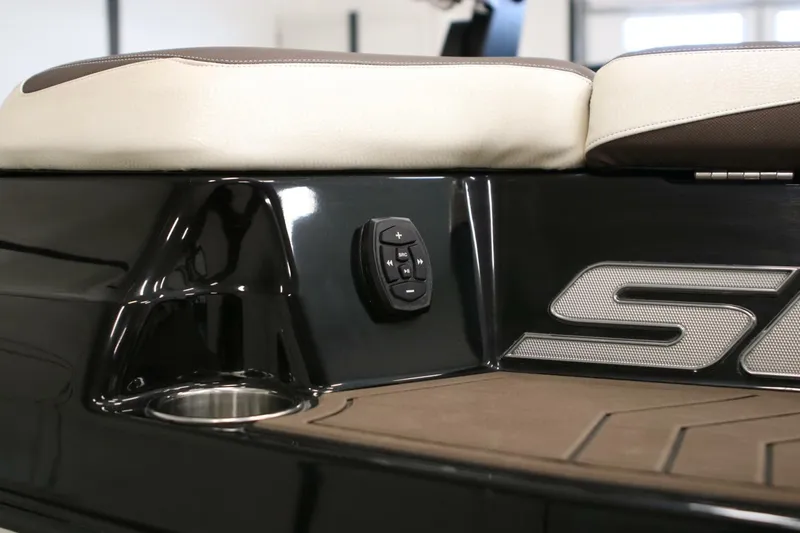 Slide: The Image of 2018 Supra SR400 boat interior with control panel and cushioned seating. - 72