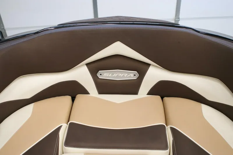 Slide: The Image of 2018 Supra SR400 boat interior with brown and beige leather seating. - 8