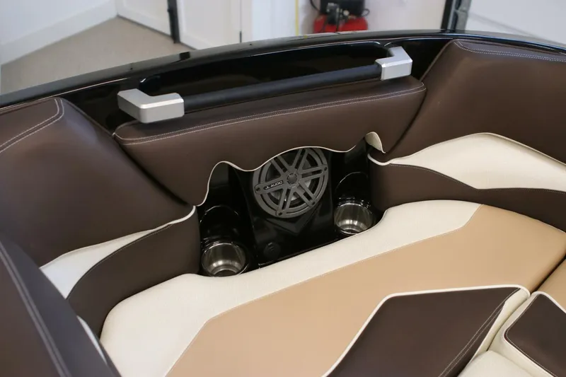 Slide: The Image of 2018 Supra SR400 interior with brown and beige leather seats, featuring a built-in speaker system. - 9