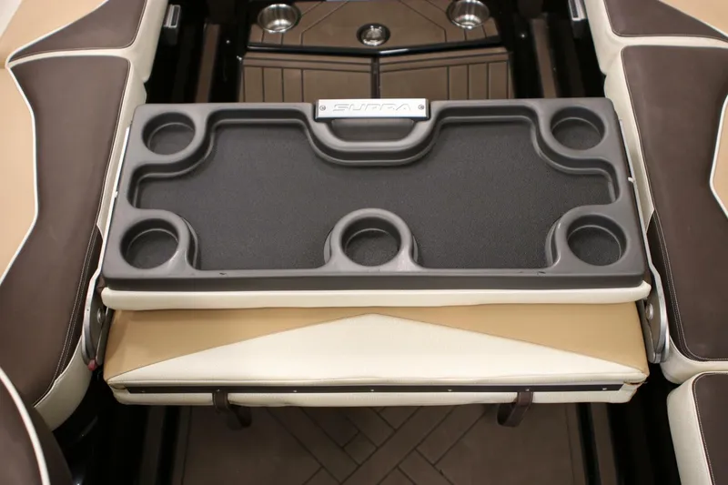 Slide: The Image of 2018 Supra SR400 boat interior with cup holders and seating area. - 96