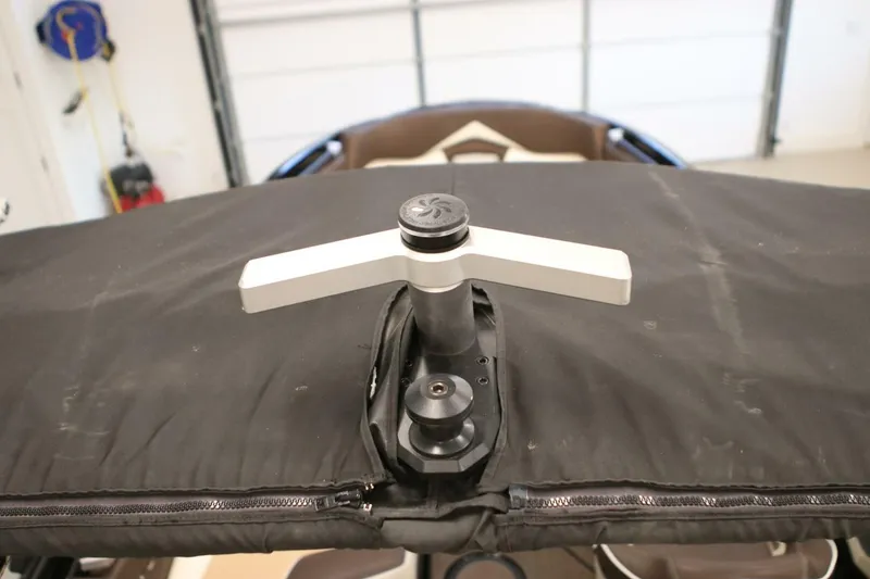 Slide: The Image of 2018 Supra SR400 boat cover with handle in a garage setting. - 105