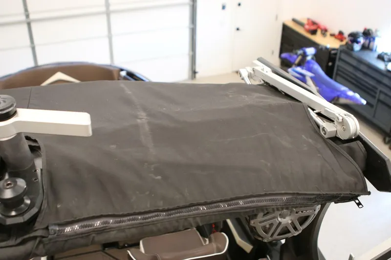 Slide: The Image of 2018 Supra SR400 boat cover with audio system in a garage setting. - 106
