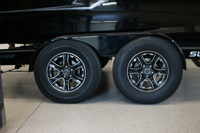 Slide: The Image of 2018 Supra SR400 trailer wheels with sleek black and chrome rims. - 117