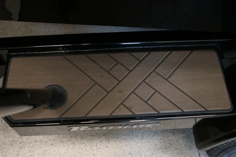 Slide: The Image of 2018 Supra SR400 boat step with textured wood pattern and black trim. - 121