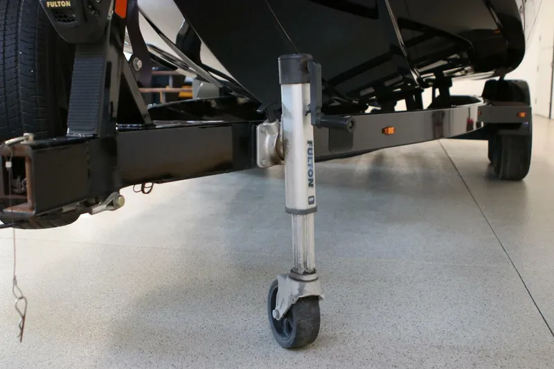 Slide: The Image of 2018 Supra SR400 trailer with Fulton jack stand on a smooth garage floor. - 124