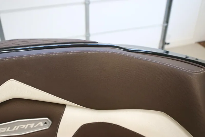 Slide: The Image of 2018 Supra SR400 interior detail with brown and cream upholstery. - 13