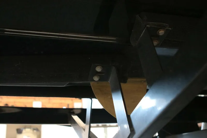 Slide: The Image of Underside view of 2018 Supra SR400 boat, showcasing structural components and mounting hardware. - 132