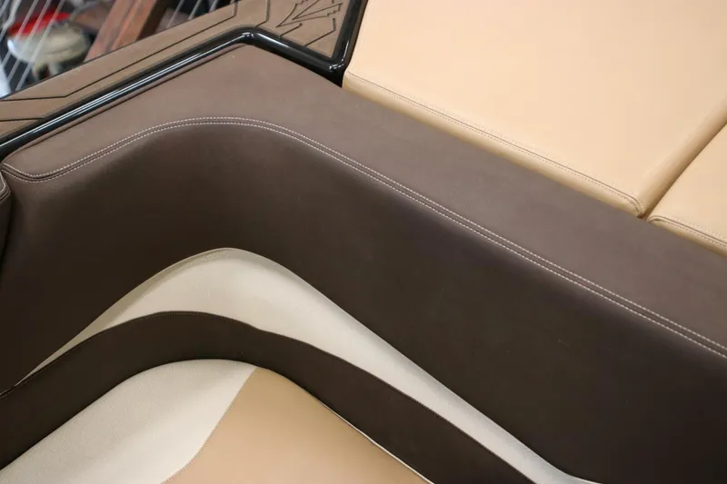 Slide: The Image of Brown and beige interior seating of a 2018 Supra SR400 boat. - 28