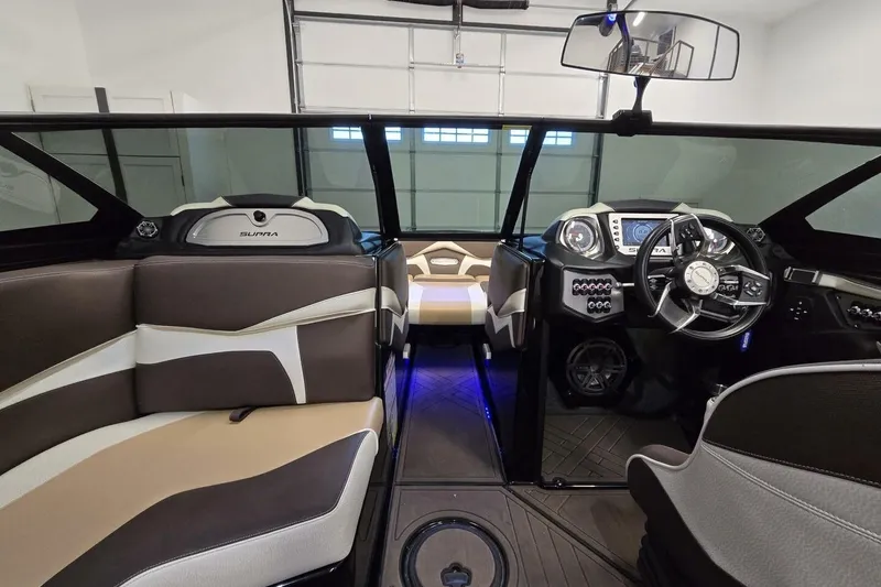 Slide: The Image of 2018 Supra SR400 boat interior with modern dashboard and seating. - 33