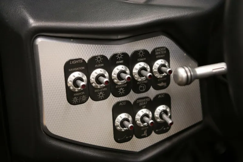 Slide: The Image of Control panel of a 2018 Supra SR400 boat with various toggle switches. - 36