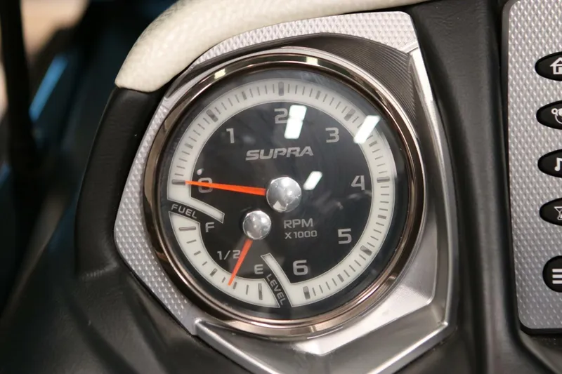 Slide: The Image of Close-up of 2018 Supra SR400 tachometer and fuel gauge, displaying RPM and fuel levels. - 40