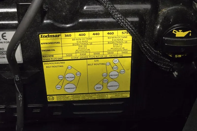 Slide: The Image of Engine specifications label for Indmar, showing fuel, oil, RPM, and belt routing details. - 59