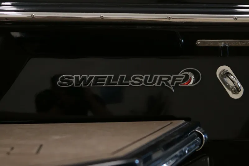 Slide: The Image of 2018 Supra SR400 boat with SwellSurf logo on black surface. - 71