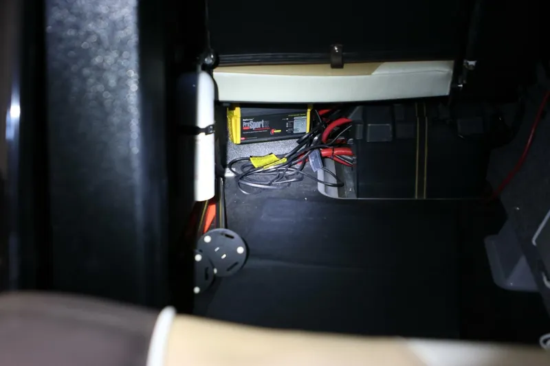 Slide: The Image of 2018 Supra SR400 interior showing battery compartment and wiring setup. - 82