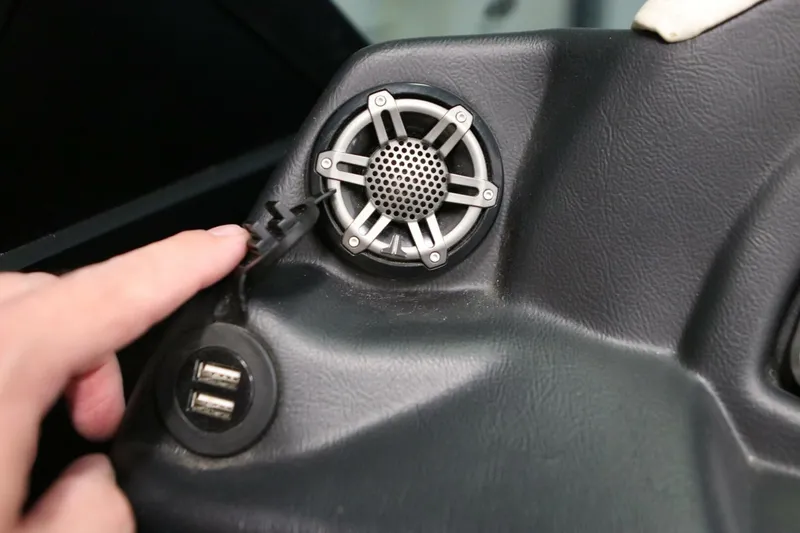 Slide: The Image of Dashboard of 2018 Supra SR400 with speaker and USB ports. - 93