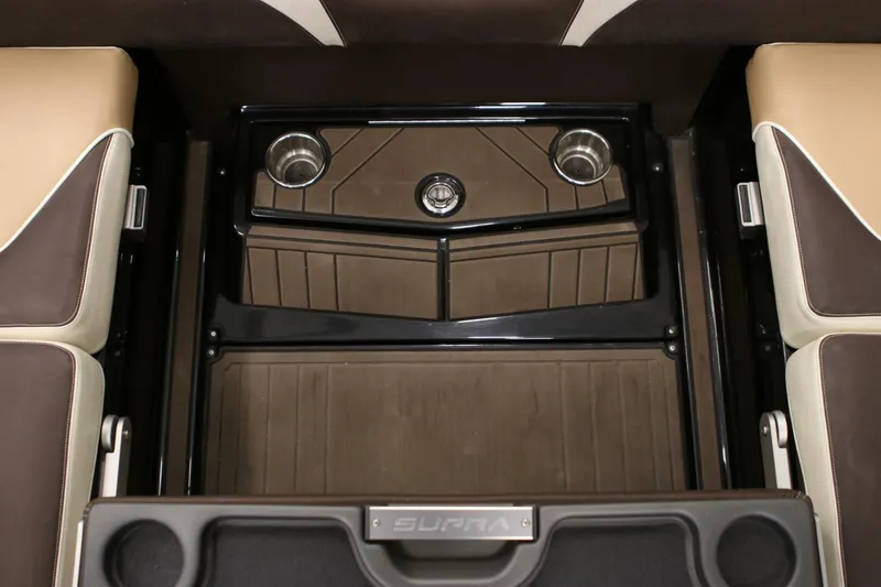 Slide: The Image of 2018 Supra SR400 interior with cup holders and brown seating. - 97