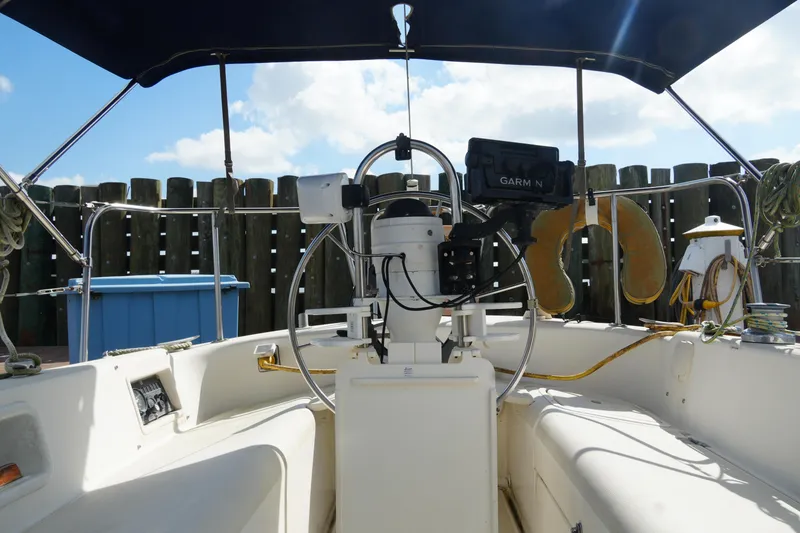 Slide: The Image of Cockpit of 1985 Pearson 303 sailboat with Garmin navigation system and life preserver. - 13