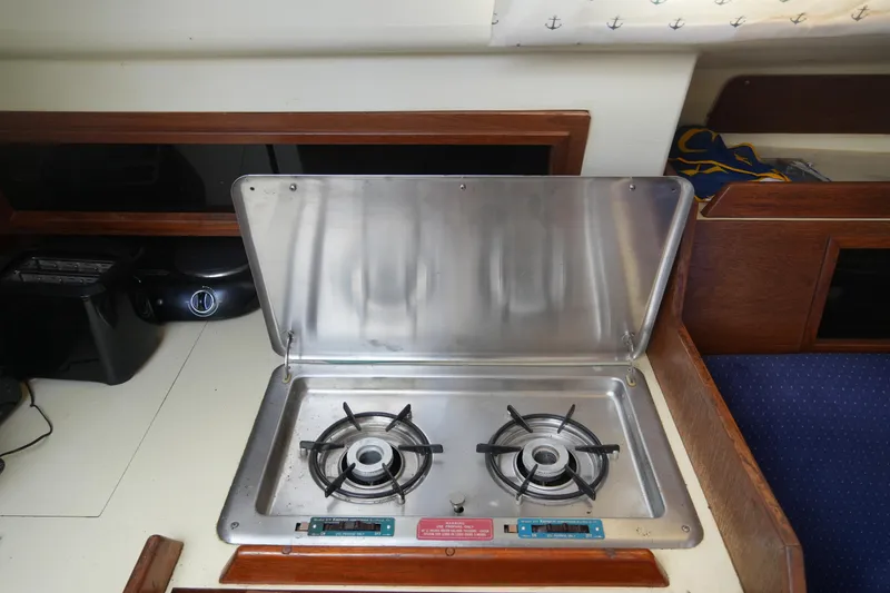 Slide: The Image of Compact kitchen stove in a 1985 Pearson 303 sailboat galley. - 25