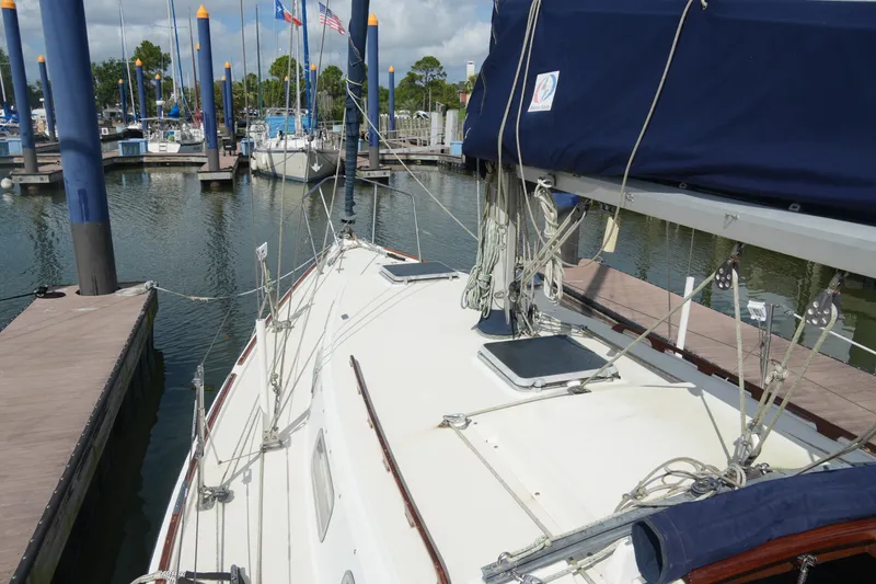 Slide: The Image of Sailboat docked at marina, Pearson 303 model, 1985, with rigging and blue sail cover. - 8