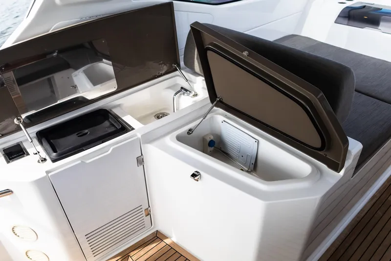 Slide: The Image of 2019 Azimut Atlantis 43 yacht interior with open storage compartments and sleek design. - 13