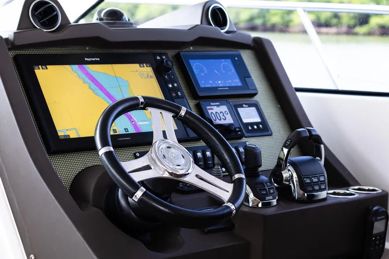 Slide: The Image of Cockpit of 2019 Azimut Atlantis 43 yacht with navigation screens and controls. - 17