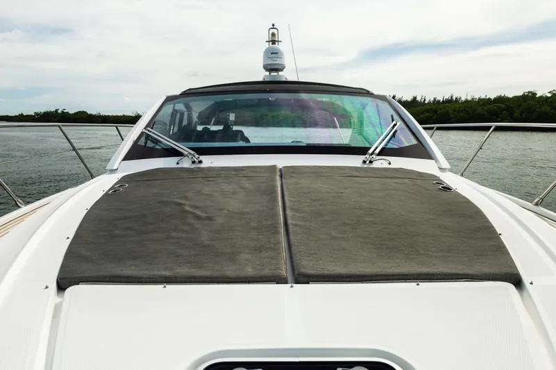 Slide: The Image of 2019 Azimut Atlantis 43 yacht with sleek deck design on calm waters. - 19