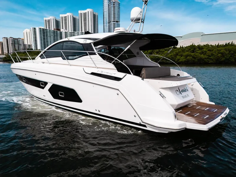 Slide: The Image of 2019 Azimut Atlantis 43 yacht cruising near city skyline. - 2