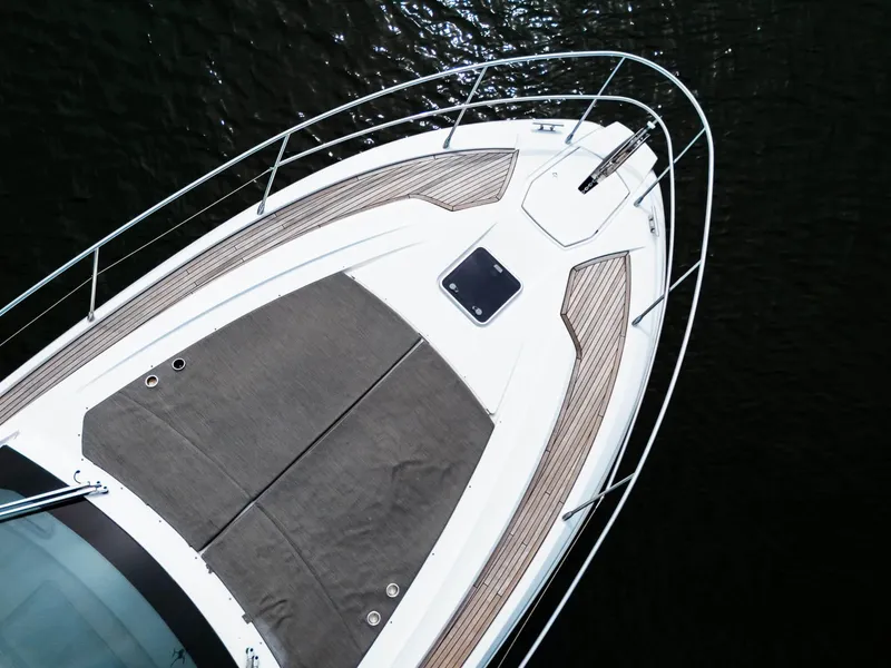 Slide: The Image of 2019 Azimut Atlantis 43 yacht bow with sleek design and sunbathing area. - 22