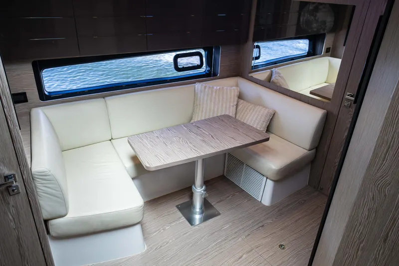 Slide: The Image of Interior of 2019 Azimut Atlantis 43 yacht with cozy seating and wooden table. - 25