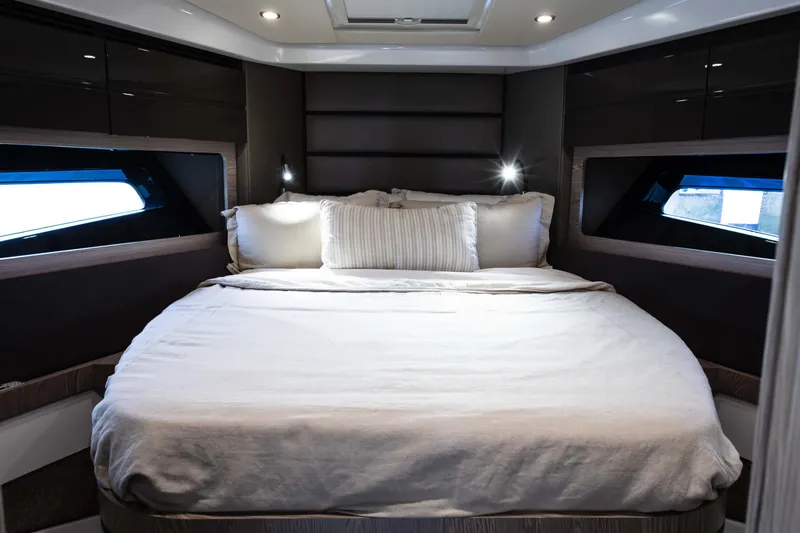Slide: The Image of Luxurious bedroom interior of 2019 Azimut Atlantis 43 yacht with cozy bedding. - 26