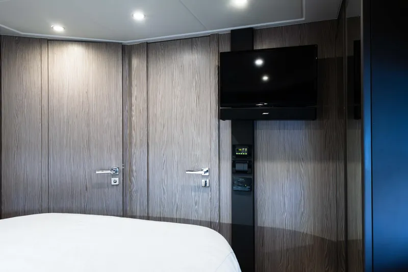 Slide: The Image of Interior of 2019 Azimut Atlantis 43 yacht with modern wood paneling and wall-mounted TV. - 29