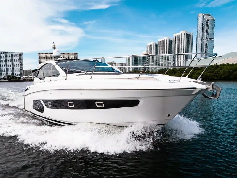 Slide: The Image of 2019 Azimut Atlantis 43 yacht cruising near modern city skyline. - 3