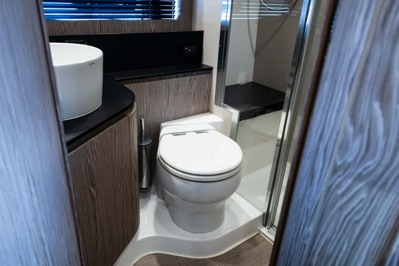 Slide: The Image of Luxurious bathroom in 2019 Azimut Atlantis 43 yacht with modern fixtures and wood accents. - 32