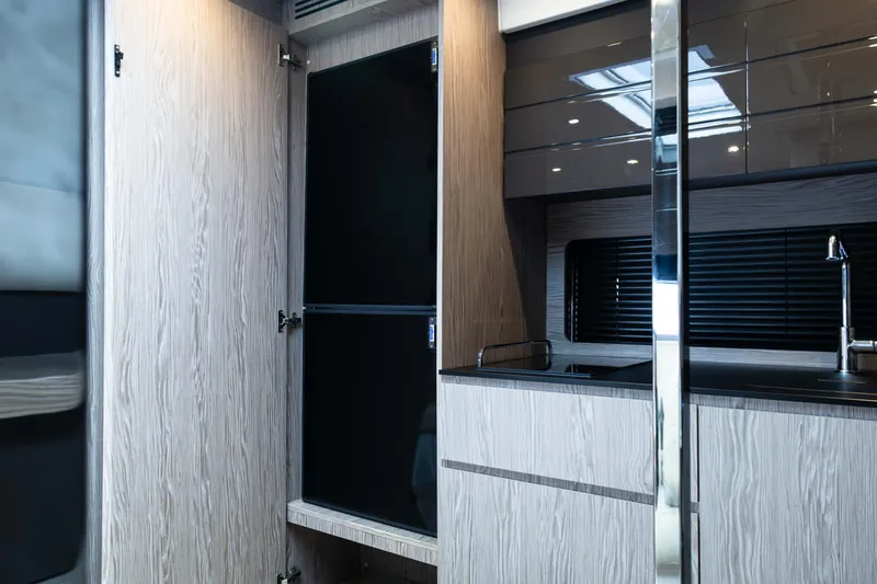 Slide: The Image of Modern kitchen interior of 2019 Azimut Atlantis 43 yacht, featuring sleek cabinetry and fixtures. - 33