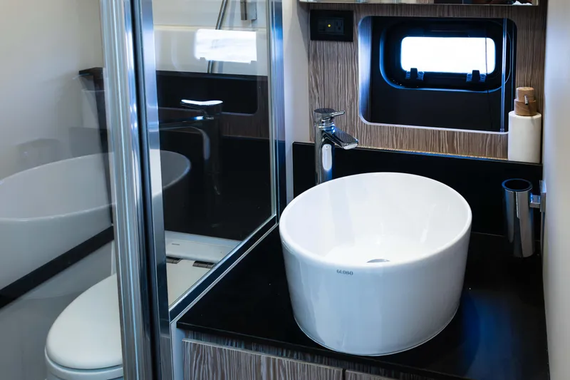 Slide: The Image of Luxurious bathroom in 2019 Azimut Atlantis 43 yacht with modern sink and window. - 37